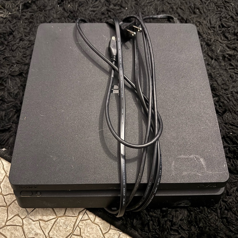 Sony Black Gaming Console with Cables